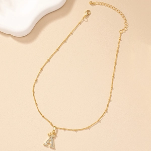 Golden A-letter crown necklace with sparkling pavé crystals on elegant satellite chain