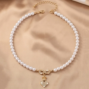 Elegante hart hanger ketting met parels en oneindigheidsteken in goudfinish