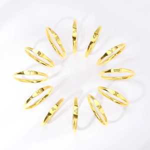 Set of 12 zodiac rings in 18k gold plated stainless steel arranged in a circle