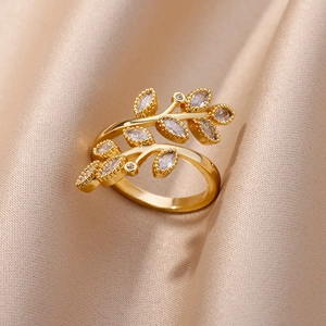 Macro detail of golden branch ring with marquise-cut marquise-cut leaf zircons