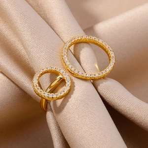 Macro detail of gold geometric double layered ring with sparkling pavé cubic zirconia