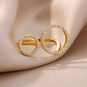 Detail of gold double circle open ring featuring micro-pave white zircon on silk