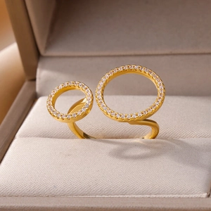 Detail of gold double-circle ring with micro-pave zircons in a jewelry box