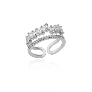 Detailed macro shot showing crown-shaped silver ring with rectangle and round zircon stones