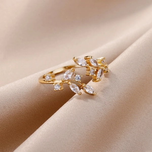 Macro view of gold branch ring with sparkling marquise and round cubic zirconia stones