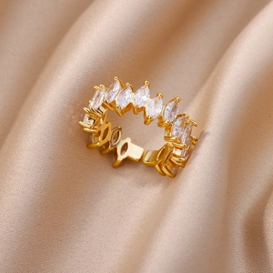 Detailed shot of marquise-cut white zircons set on a gold-plated adjustable ring band