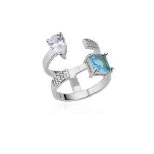 Macro shot of multi-layer silver ring with pear-cut zircon and square blue stone details