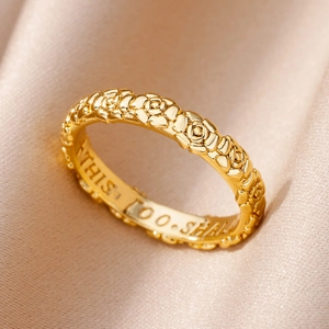 Detailed view of 18k gold plated ring featuring rose relief and This Too Shall Pass engraving
