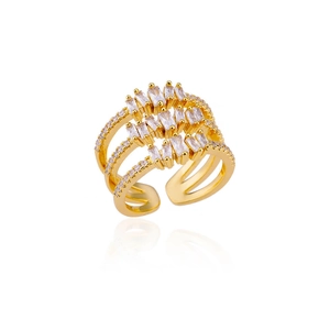 Detailed macro view of multi-layer gold-plated ring with rectangular zircon stones