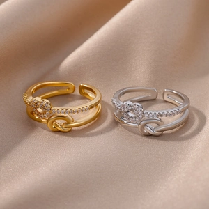 Elegant multi-layer geometric zircon rings in gold and silver finish with silk background