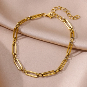 Detailed close-up of a gold-plated stainless steel paperclip chain with lobster clasp and silk