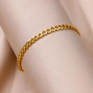 Detail of 18k gold plated stainless steel curb chain anklet on a silk display