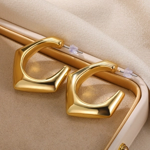 Minimalist gold-plated hollow crescent C-shape hoop earrings with polished metal finish