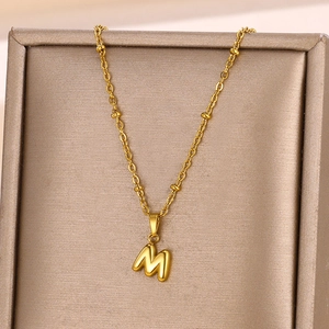 Minimalist 18K gold plated bubble letter M pendant on delicate beaded chain necklace
