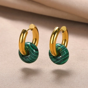 Detailed close-up of vintage gold hoop earrings featuring green malachite stone donuts