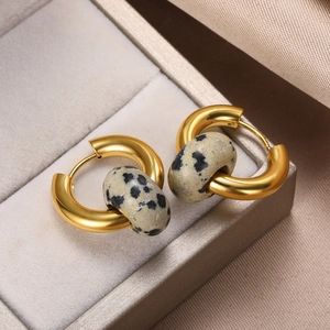 Detail of gold-plated hoop earrings featuring natural dalmatian jasper stone beads