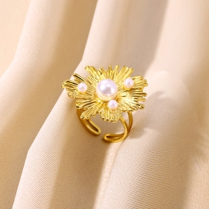 Vintage golden flower ring with pearls and brushed metal texture for women