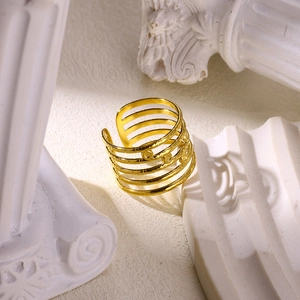 Detailed view of the layered gold-plated stainless steel ring with a hammered texture