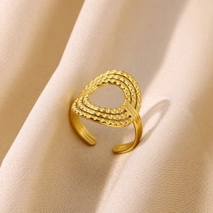 Detail of 18K gold open ring with multi-layer oval hollow design and grainy texture