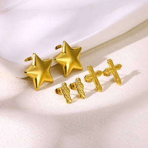 Three pairs of 18K gold-plated stainless steel stud earrings with star and cross designs