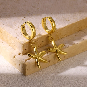 Golden starfish hoop earrings with textured finish on elegant beige stone base