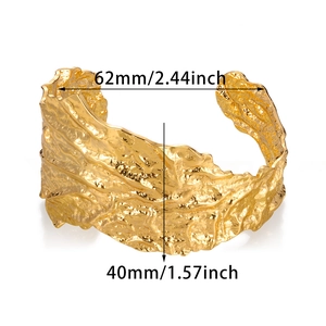 Irregular textured gold cuff bracelet with hollow C-shape design and 40mm width