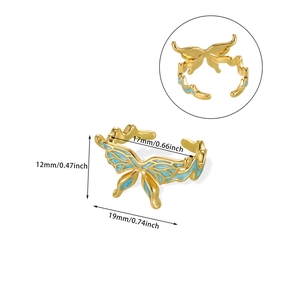 Detail view of gold butterfly ring with blue enamel wings and precise dimensions