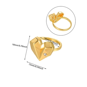 Minimalist gold heart-shaped ring with cubic zirconia and geometric cutout details