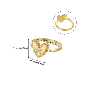 Detail showing an 11mm cream heart ring with a gold bow relief and size markings