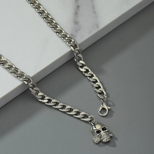 Silver skull and rose pendant on a chunky Cuban link chain waist belt for women