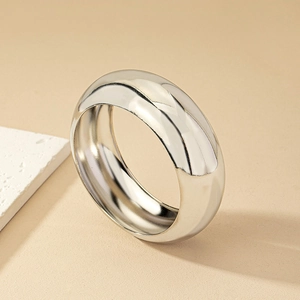 Polished silver dome ring with a minimalist thick metal band and mirror finish