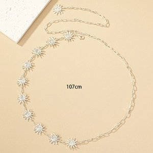 Detail of silver sun face charms on a 107cm bohemian style metal chain belt