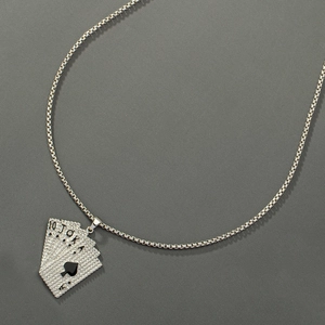 Macro shot of silver hip-hop necklace showing the iced-out Ace of Spades poker pendant details
