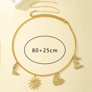 Detail of gold metal waist chain with textured letter pendants and sun heart charms