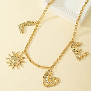 Golden multi-pendant waist chain featuring sun, heart, and letter E charms with hammer texture