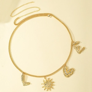 Gold punk hip hop body chain with LVE letters and sun pendant on beige background