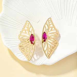 Elegant hollow butterfly stud earrings with gold plating and magenta crystal center