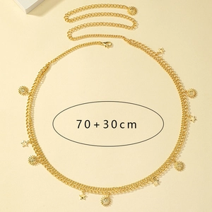 Detail of bohemian gold waist chain with sun and star pendants and 70+30cm length mark
