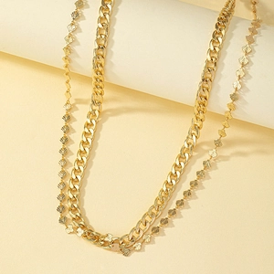 Trendy double-layered gold body chain with cuban links and bohemian shell charms