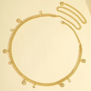 Detailed close-up of double-layer gold waist chain featuring sun and star pendants