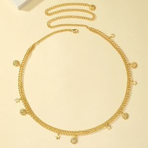 Bohemian gold double-layered waist chain featuring sun and star pendants on beige background