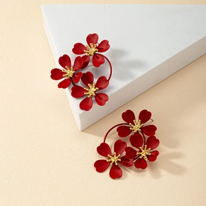 Retro burgundy flower earrings with matte red petals and golden centers in asymmetrical style
