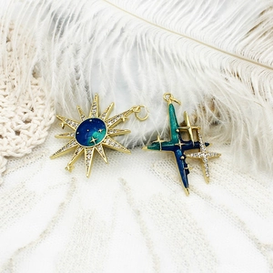 18K gold plated celestial starburst pendants with navy blue enamel and sparkling zircons