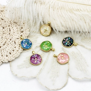 Colorful abalone shell cross pendants with gold plating in various natural colors