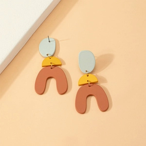 Minimalist geometric dangle earrings in light green mustard yellow and orange clay