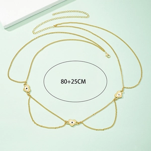 Detail view of gold evil eye waist chain with three heart pendants and 25cm extender