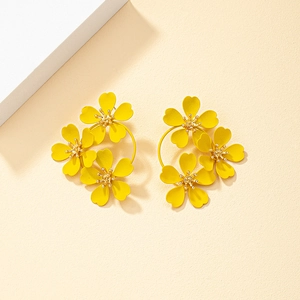 Exaggerated matte yellow triple daisy floral stud earrings with textured golden center