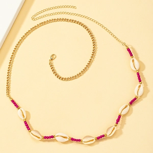 Bohemian body chain with gold metal link, white shells and hot pink beads accessory