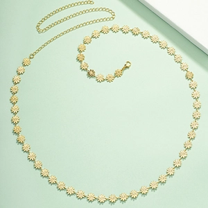 Detail of golden daisy waist chain with delicate floral metal links and lobster clasp