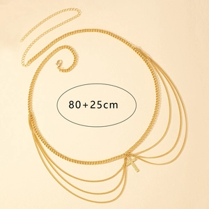Detail view of gold layered waist chain with rhinestone cross pendant and 80+25cm adjustment